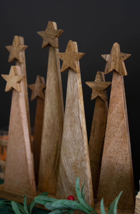 Seven Wooden Christmas Trees on a Base